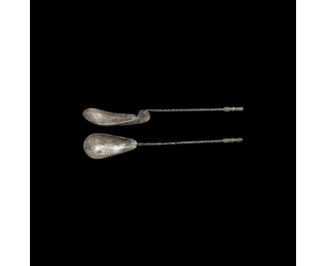 Early 6th century AD. A large silver ritual or baptismal spoon with deep piriform bowl, chamfered rim and incised expanding-a