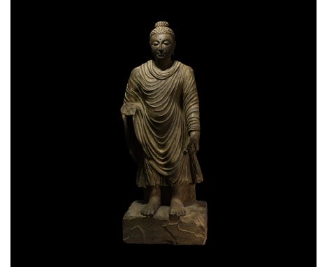 2nd-3rd century AD. Finely modelled in schist, the Buddha appears before his following with a serene and compassionate facial