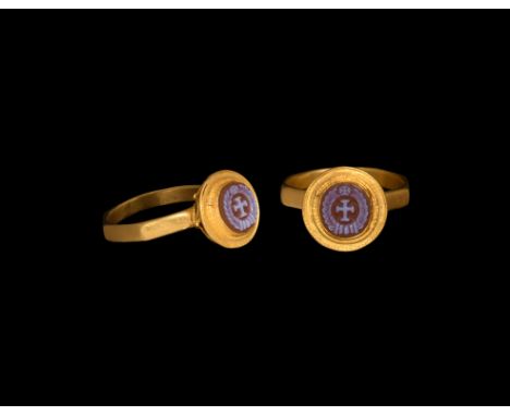 5th-7th century AD.&nbsp;A banded carnelian or banded agate gemstone featuring a cross potent within a wreath, set into a lat