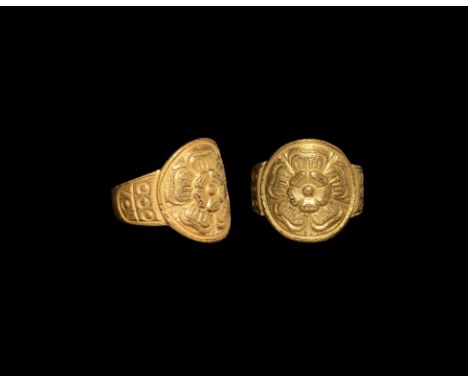 Late 16th century AD. A gold finger ring with discoid plaque and low-relief Tudor rose.  9.96 grams, 21.28mm overall, 17.99mm