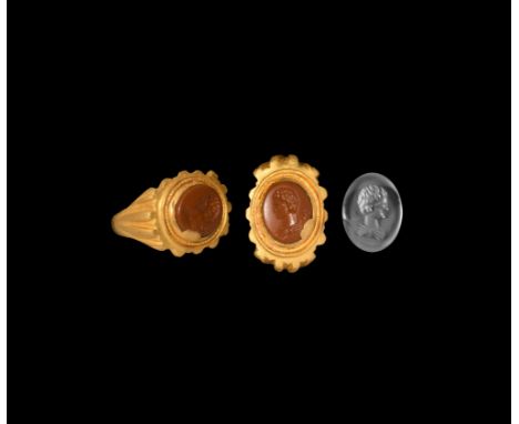 3rd century AD. An ellipsoid jasper gemstone with intaglio female portrait bust in profile, with tiered hairstyle and palla c