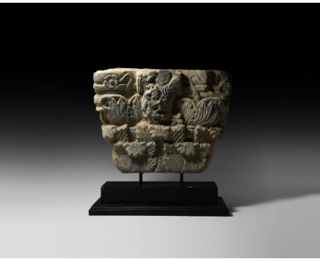 2nd-3rd century AD. A carved schist plaque with three tiers of acanthus leaves beneath horizontal bands with curled stalks an