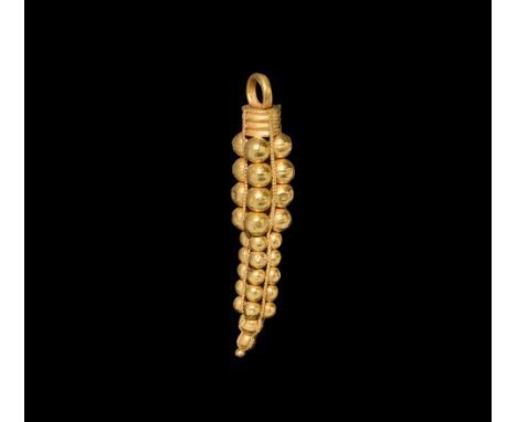 3rd century AD. A substantial pendant formed as a graduated pyramid of hollow-formed gold bulbs with twisted filigree straps,