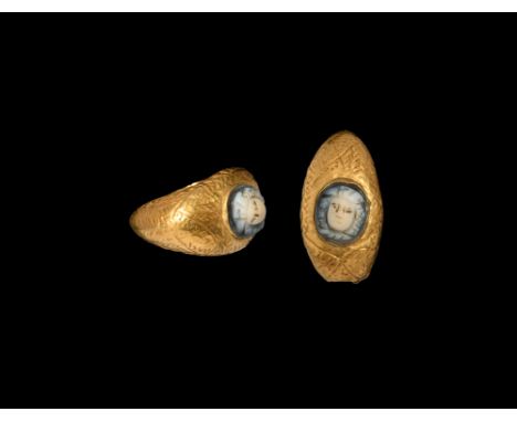 2nd-3rd century AD. A gold-sheet finger ring with possibly later leaf detailing, cell to the bezel with inset onyx cameo gorg