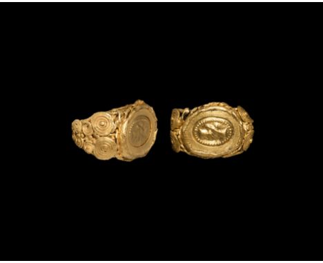 Later 4th century AD. A gold finger ring comprising a large ellipsoid bezel and tapering shoulders; the underside with ribbed