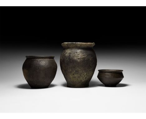 5th-6th century AD. A group of three unglazed ceramic vessels comprising two taller urns each with rounded rim and shallow sh
