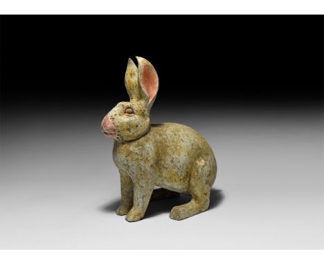 Early Tang Dynasty, 618-906 AD. A ceramic figure of a rabbit with painted detailing to the eyes, nose and ears.  2.7 kg, 30cm
