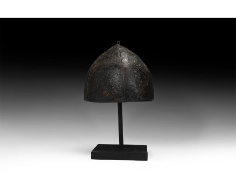 11th-12th century AD. A four-plate iron helmet constructed from curved triangular sections with a slight point at the apex; t