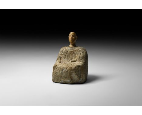 Late 3rd-early 2nd millennium BC. A carved chlorite two-part figurine comprising: a carefully modelled limestone head with fi