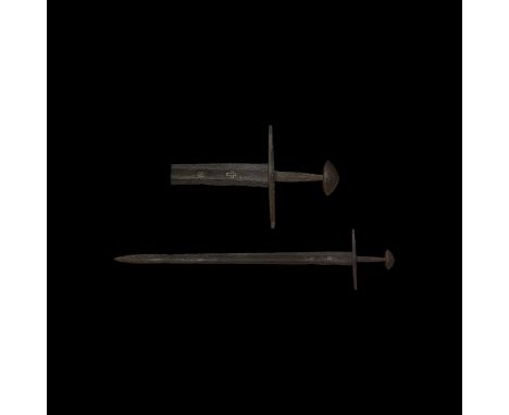 Mid 10th-mid 11th century AD. A western European long double cutting sword with broad tapering blade with evidence of its use