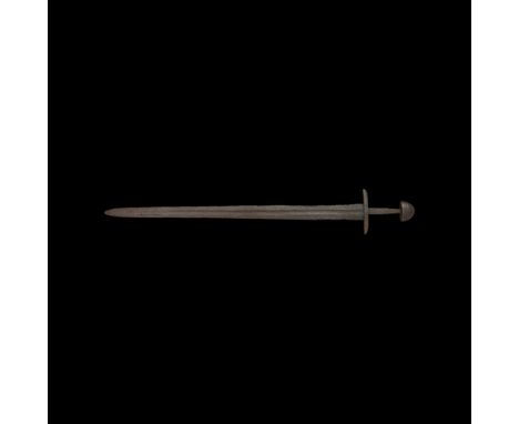 10th-11th century AD. A fine double-edged sword with tapered pattern-welded blade, still retaining well-defined cutting edges