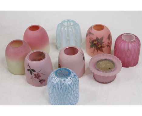 A collection of fairy light shades, to include a blue vaseline example and Burmese glass examplesThe two blue shades and the 