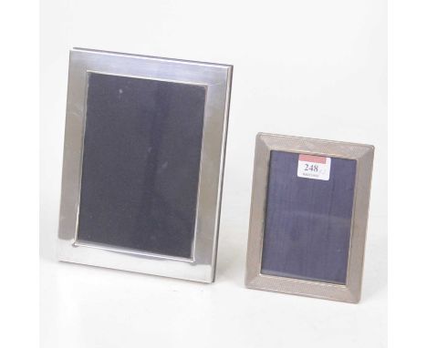 A modern Carrs silver clad easel photograph frame, of plain rectangular form, 21.5 x 16.5cm; together with another smaller en