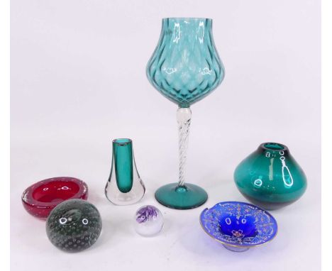 A collection of glassware to include a turquoise oversized wine glass, height 36cm, together with a green art glass vase and 