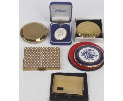 A lady's gilt metal powder compact, of rectangular form, with engine turned decoration, by Kigu of London; together with vari