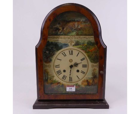 A reproduction burr walnut cased mantel clock, the printed paper dial decorated with wild animals, and showing Roman numerals