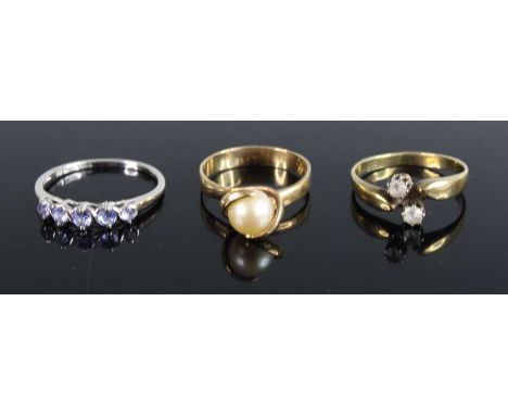 A modern 9ct white gold and amethyst set five-stone dress ring, size U; together with a 9ct yellow gold and cultured pearl se