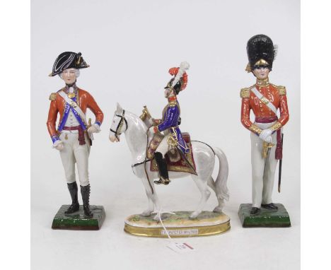 A Rudolf Kammer Volkstedt German porcelain figure of a French soldier on horseback, in full dress on an oval base titled Trom