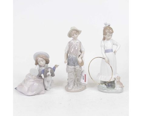 A Lladro Spanish porcelain figure of a boy with wicker basket upon his shoulder, having printed mark verso, h.23cm; together 
