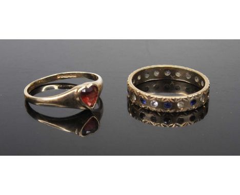 A 9ct gold garnet set dress ring, size M; together with a 9ct gold blue and white sapphire set eternity ring, size N, gross w
