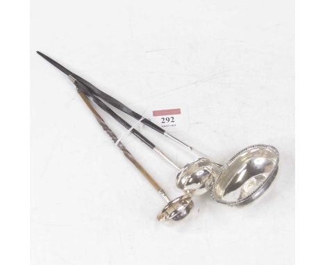 A George III silver toddy ladle, of oval form with beaded rim, inset with a George III shilling, on a turned whalebone handle