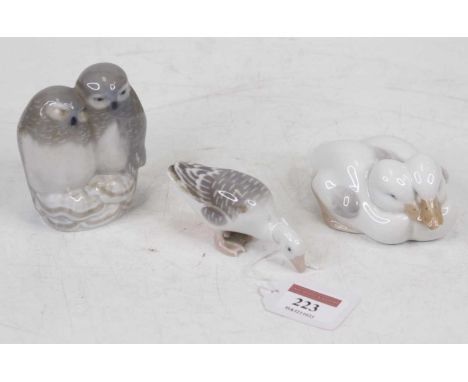 A Royal Copenhagen porcelain figure group of two owls, designed by Theodore Madsen, having printed mark verso and numbered 83