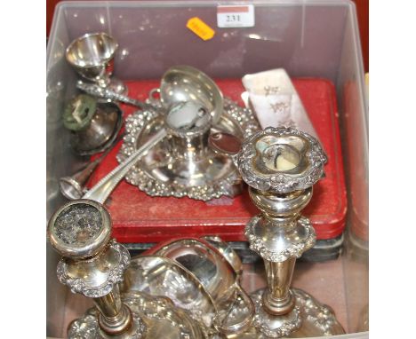 A box of miscellaneous metalware to include a pair of Old Sheffield plate table candlesticks, chamber stick, egg cups, sauce 