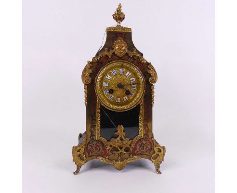 A late 19th century French boule-work mantel clock, the gilt metal dial having enamel cartouches showing Roman numerals, havi