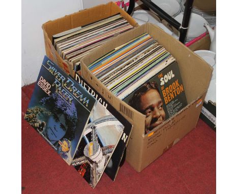 A collection of 12" vinyl records to include Peggy Lee - I'm a Woman, Nat King Cole - Sings Spirituals, Monty Python - Live a