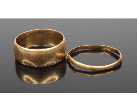 An 18ct gold wedding band, 5.8g, size M; together with a 22ct gold wedding band, 0.8g (cut) (2)