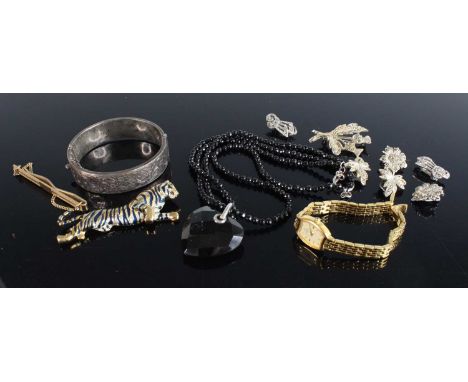 Assorted costume jewellery to include a silver hinged bangle, lady's fashion watch, assorted brooches etc 