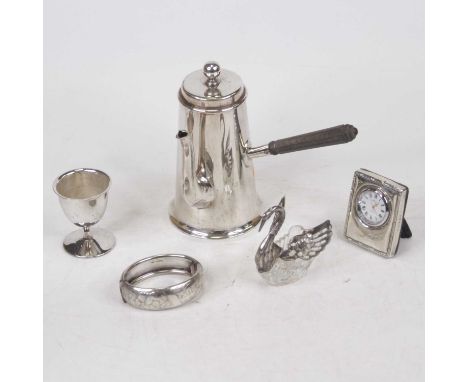 A collection of miscellaneous items, to include a modern Carrs silver clad quartz movement clock, silver plated chocolate pot