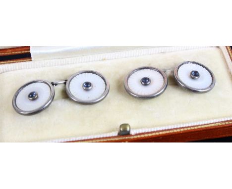 A cased pair of sterling silver mother of pearl and blue paste set gent's cufflinks, the case dated 1930