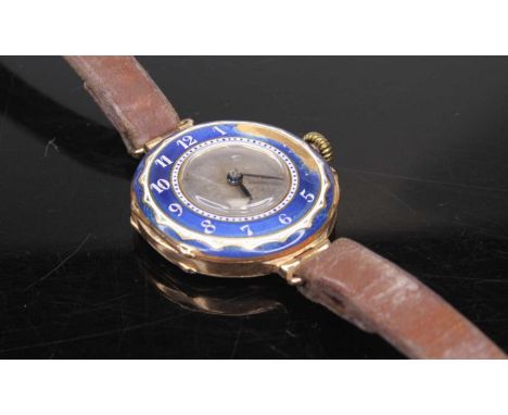 A vintage lady's 15ct gold and enamel wristwatch, having manual wind Swiss movement, case dia.25mm, on leather bracelet (enam