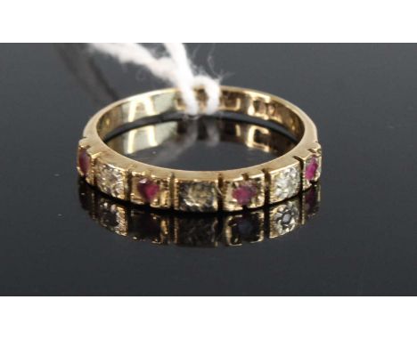 A modern 9ct gold ruby and diamond point 7 stone half hoop ring, size M/N, 2g