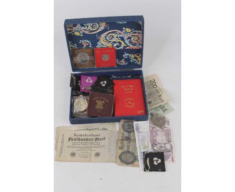 A collection of miscellaneous coins to include Isle of Man decimal coin wallet, Britains First Decimal Coin wallet, 1951 Fest