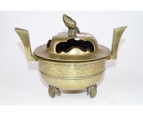 A Japanese brass koro, the pierced lid surmounted by pine cone finial, the body with a band of engraved floral decoration, st
