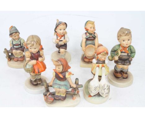 A collection of seven various Hummel figures, height of largest 13cmGirl holding basket – broken and glued at ankles.Girl wit