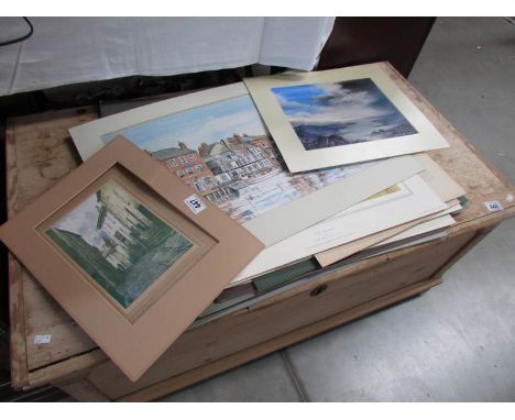 A quantity of unframed paintings and prints.