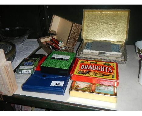 A mixed lot of playing cards etc.,