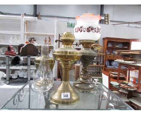 3 brass oil lamp bases and a shade.