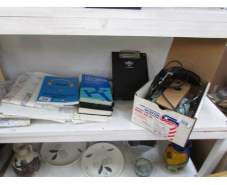 A quantity of air navigation items including maps, pilot books, navigational tools and a set of David Clark headphones H10-40