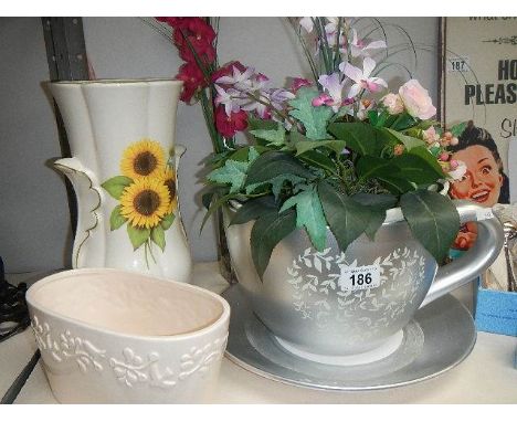 A vase, a planter and a large cup & saucer planter.