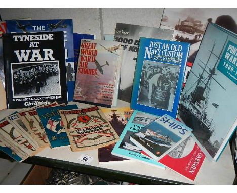 A shelf of mainly war related books and magazines.