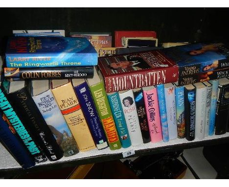 A shelf of hardback books.