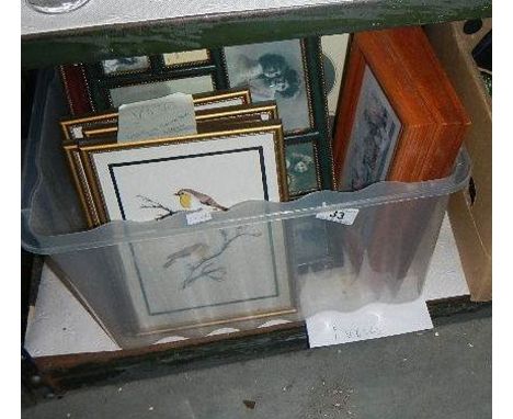 A box of assorted prints.