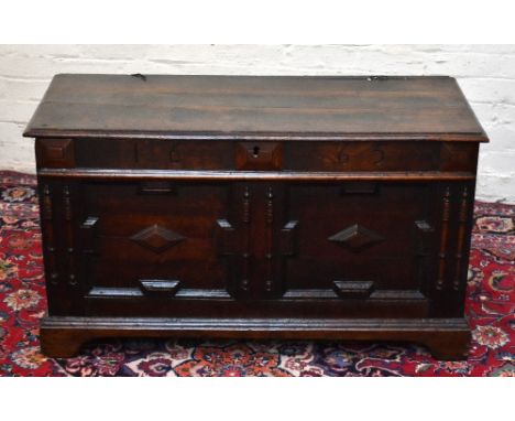 An 18th century oak coffer, with twin panelled front on bracket feet, height 62cm, width 11cm, depth 49cm.Additional Informat