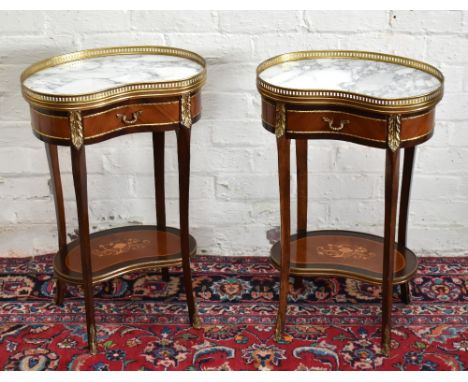 A pair of reproduction French style kidney shaped side tables with inset marble tops and brass gallery backs, above single dr