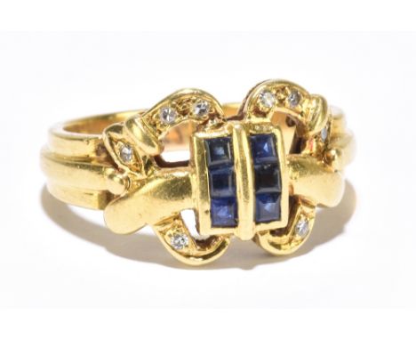 An 18ct yellow gold sapphire and diamond ring, the central section set with six square cut sapphires within a pierced frame s