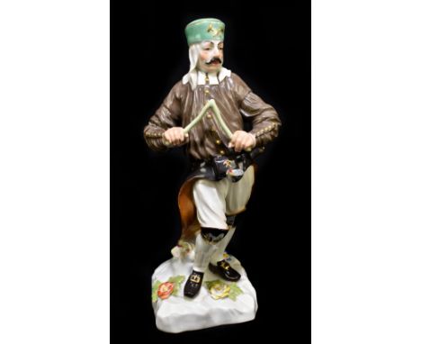 MEISSEN; an early 20th century figure of a Saxon miner with divining rod, after the original by Kändler and Reinicke, painted